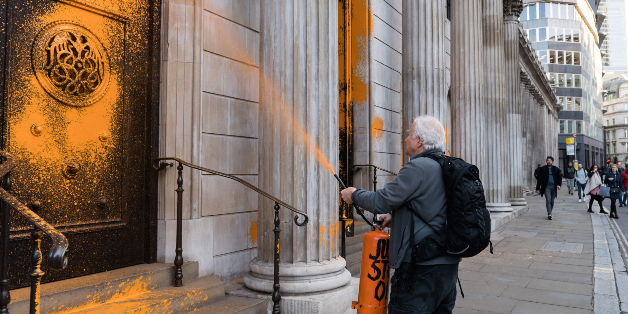 Environmental activists spray paint on iconic buildings in London